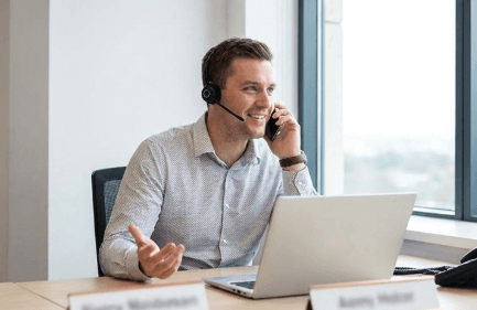 Professional providing business support on a call in an office